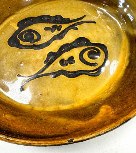 Lot 56 - Charles Tustin (1922-1966) at WInchcombe Pottery, a slipware dish