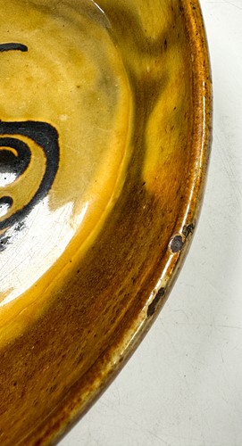 Lot 56 - Charles Tustin (1922-1966) at WInchcombe Pottery, a slipware dish