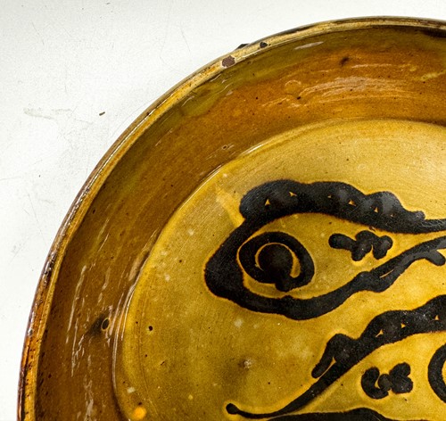 Lot 56 - Charles Tustin (1922-1966) at WInchcombe Pottery, a slipware dish