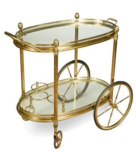 Lot 475 - A brass two-tier drinks trolley