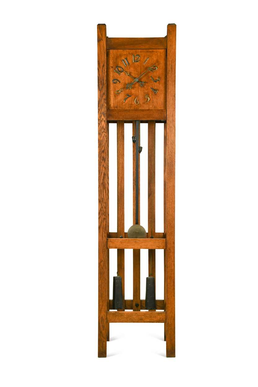 Lot 184 - An Arts & Crafts or American Mission oak longcase clock