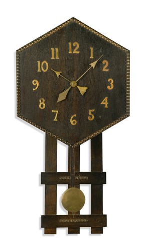 Lot 251 - An Arts & Crafts oak wall clock