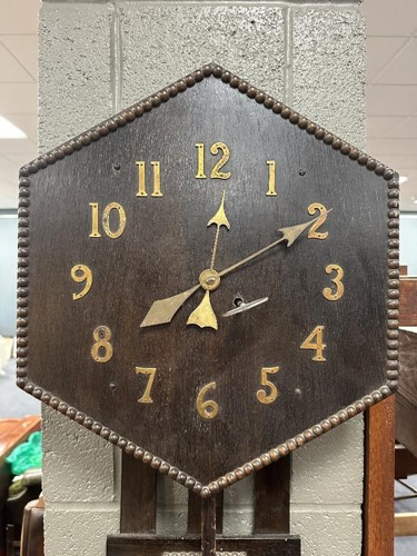 Lot 482 - An Arts & Crafts oak wall clock