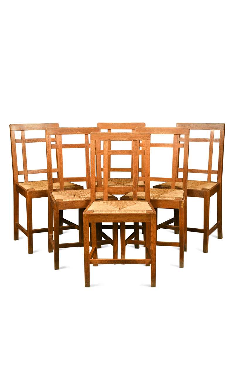Lot 266 - Paul Matt for Brynmawr Furniture, a set of twelve Arts & Crafts oak 'Mount' dining chairs
