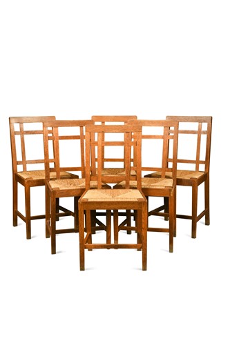 Lot 266 - Paul Matt for Brynmawr Furniture, a set of twelve Arts & Crafts oak 'Mount' dining chairs