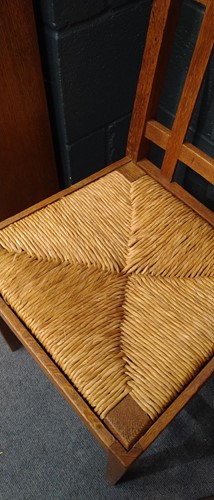 Lot 266 - Paul Matt for Brynmawr Furniture, a set of twelve Arts & Crafts oak 'Mount' dining chairs