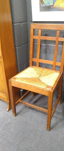 Lot 266 - Paul Matt for Brynmawr Furniture, a set of twelve Arts & Crafts oak 'Mount' dining chairs