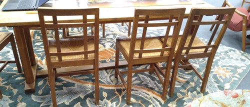 Lot 266 - Paul Matt for Brynmawr Furniture, a set of twelve Arts & Crafts oak 'Mount' dining chairs