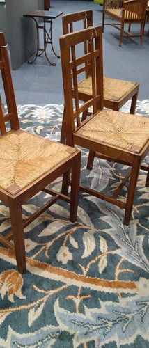 Lot 266 - Paul Matt for Brynmawr Furniture, a set of twelve Arts & Crafts oak 'Mount' dining chairs