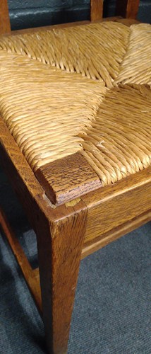 Lot 266 - Paul Matt for Brynmawr Furniture, a set of twelve Arts & Crafts oak 'Mount' dining chairs