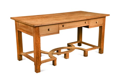 Lot 212 - Attributed to Heal's, an Art Deco limed oak partner's desk, circa 1925