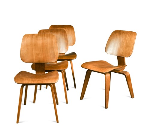 Lot 354 - In the manner of Charles & Ray Eames, a set of four DCW style chairs