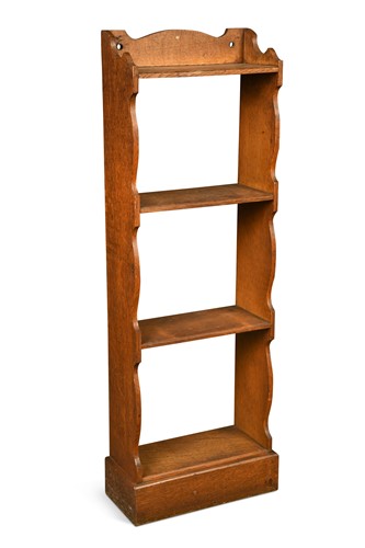 Lot 243 - An Arts and Crafts oak bookcase of small proportions