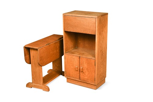 Lot 276 - A Cotswold school oak cupboard and drop leaf table