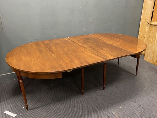 Lot 382 - A Regency D-end mahogany dining table, on 8...