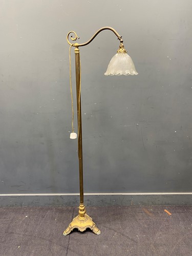 Lot 440 - A 20th century brass floor lamp with reeded...