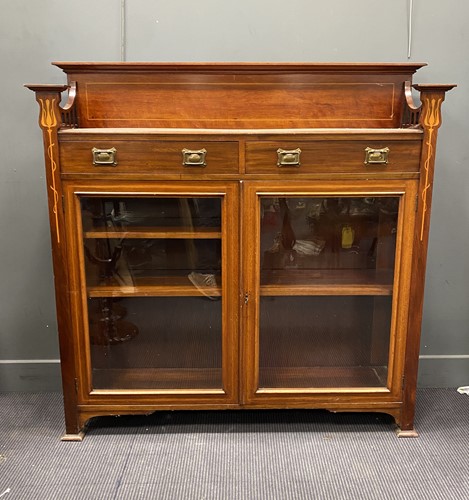 Lot 394 - A mahogany and inlaid side cabinet in Art...
