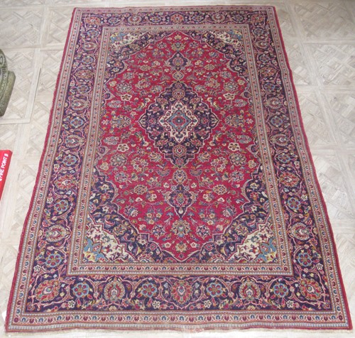 Lot 787 - Cream, red and blue ground carpet, 300cm x 285cm