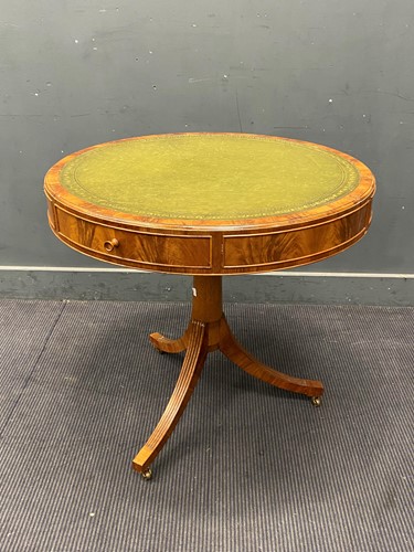 Lot 438 - A Regency style drum top library table, the...