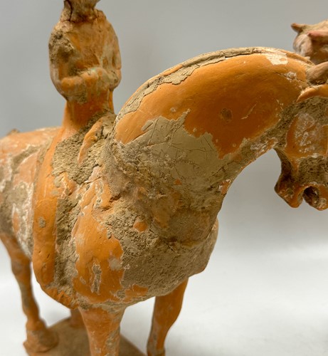 Lot 5 - Two Chinese terracotta horses with female riders, Tang Dynasty or later