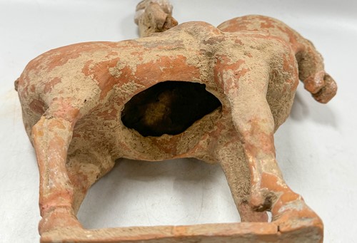 Lot 5 - Two Chinese terracotta horses with female riders, Tang Dynasty or later