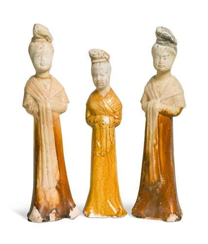 Lot 7 - A group of four Chinese partly straw-glazed pottery lady court attendants, Tang Dynasty