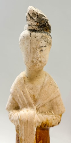 Lot 7 - A group of four Chinese partly straw-glazed pottery lady court attendants, Tang Dynasty