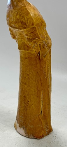 Lot 7 - A group of four Chinese partly straw-glazed pottery lady court attendants, Tang Dynasty