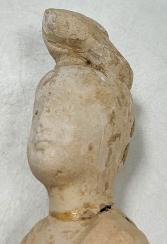 Lot 7 - A group of four Chinese partly straw-glazed pottery lady court attendants, Tang Dynasty