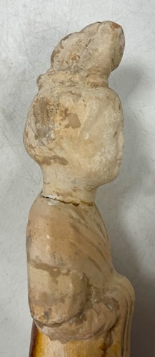 Lot 7 - A group of four Chinese partly straw-glazed pottery lady court attendants, Tang Dynasty