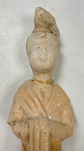 Lot 7 - A group of four Chinese partly straw-glazed pottery lady court attendants, Tang Dynasty