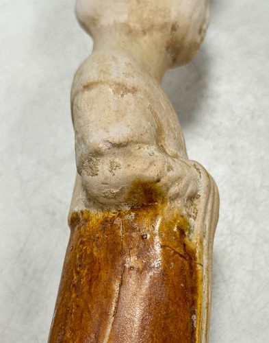 Lot 7 - A group of four Chinese partly straw-glazed pottery lady court attendants, Tang Dynasty
