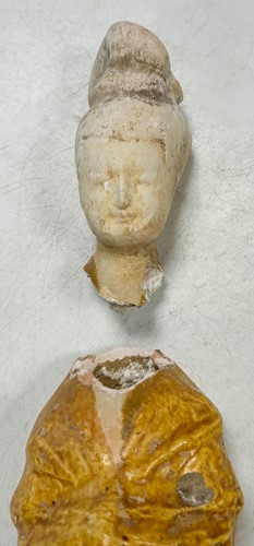 Lot 7 - A group of four Chinese partly straw-glazed pottery lady court attendants, Tang Dynasty