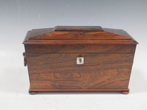 Lot 12 - A Regency rosewood tea caddy, with a fitted...