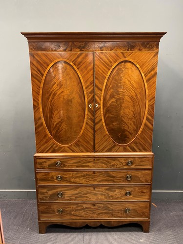Lot 396 - A 19th century mahogany linen press, with pair...