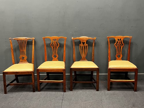 Lot 393 - A harlequin set of four George III fruitwood...