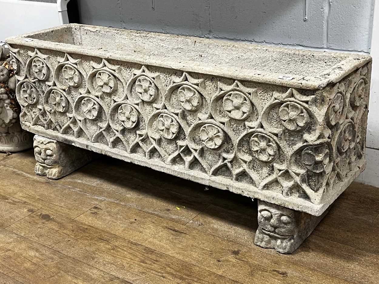 Lot 476 - A composite stone garden planter in the Gothic...