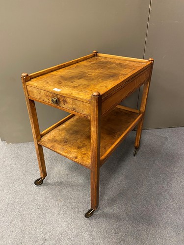 Lot 434 - A figured walnut two tier tea trolley, 79cm x...