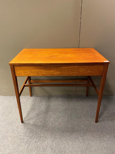 Lot 436 - A teak writing table with blind frieze drawer...