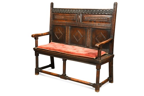 Lot 473 - A carved oak panel back settle, 17th century...