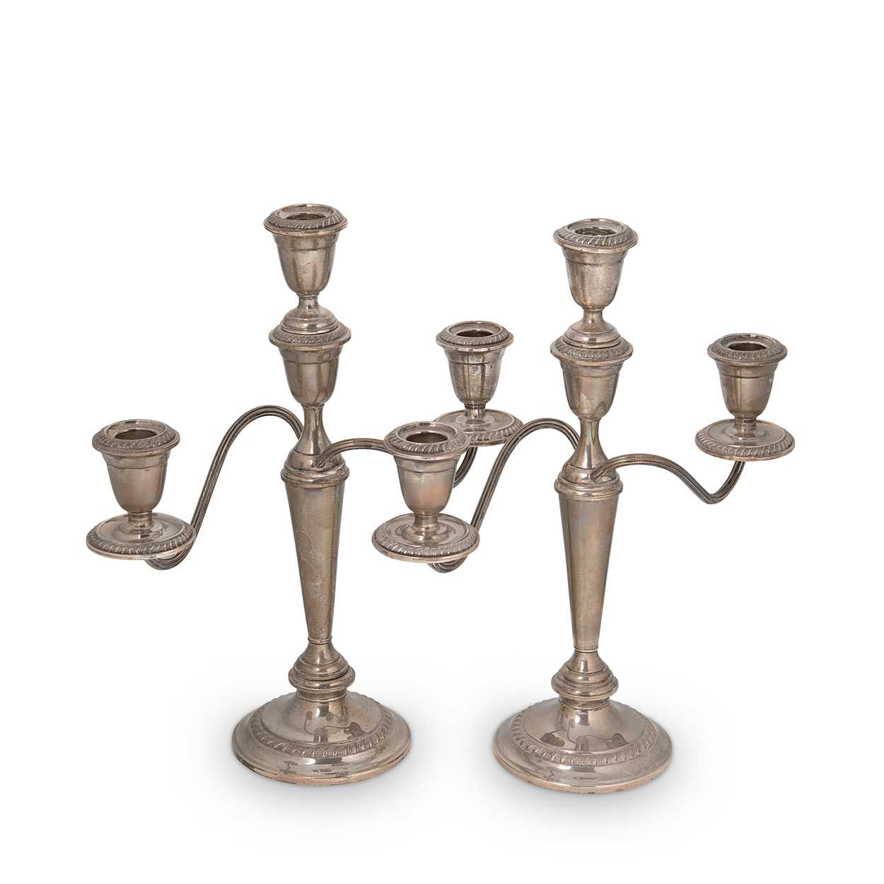 Lot 270 - A pair of 20th century American metalwares silver metamorphic three light candelabra