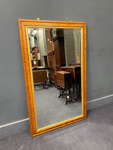Lot 445 - A large maple framed rectangular wall mirror...