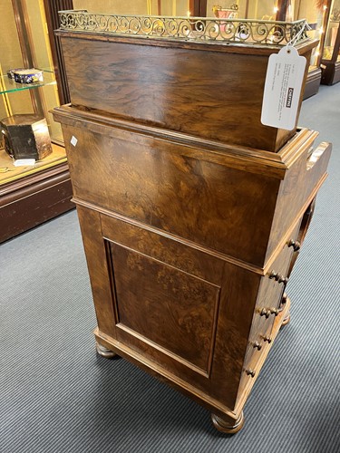 Lot 617 - A Victorian burr walnut piano top davenport