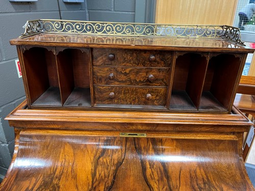 Lot 617 - A Victorian burr walnut piano top davenport
