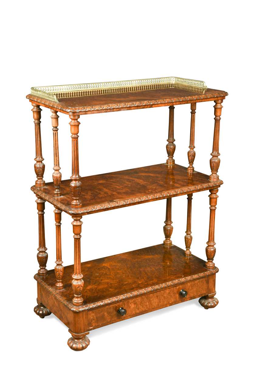 Lot 615 - A Victorian walnut three tier buffet by Gillow & Co