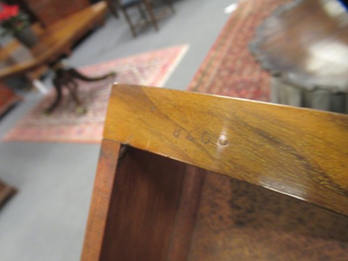 Lot 615 - A Victorian walnut three tier buffet by Gillow & Co