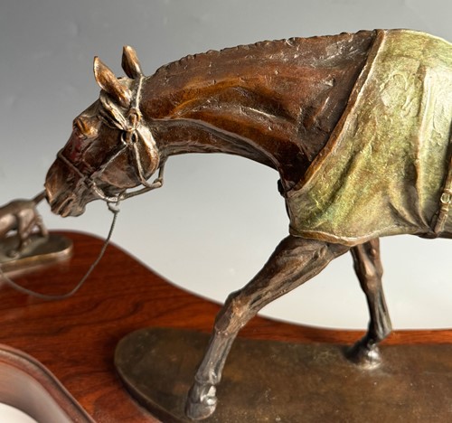 Lot 614 - Kathleen Friedenberg (contemporary), a bronze model of a stallion being led by a terrier, 1988