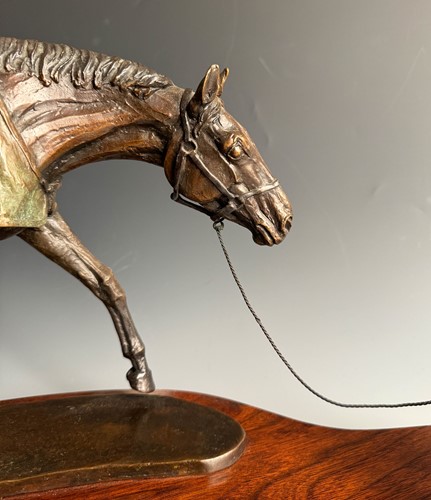 Lot 614 - Kathleen Friedenberg (contemporary), a bronze model of a stallion being led by a terrier, 1988
