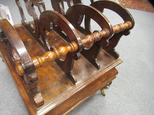 Lot 616 - A Victorian walnut canterbury