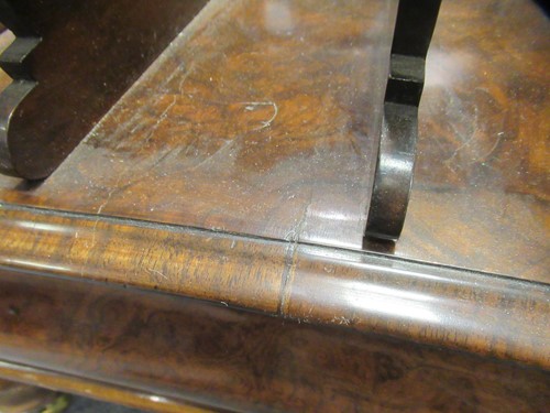 Lot 616 - A Victorian walnut canterbury